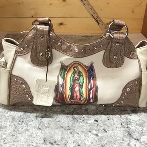 P&G purse. Faux leather. Tan w/ Mary on front NWT